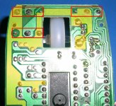 The mouse PCB showing the common connection in yellow and the switch locations in red