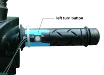Left motorcycle handgrip with the left turn button attached