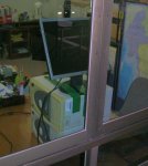 The sliding glass window with the monitor behind