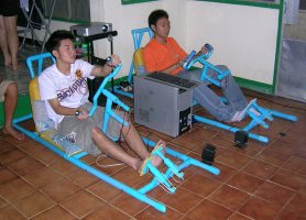 University students racing in PVC pipe cars